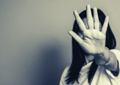 Domestic Violence and Financial Abuse thumbnail - Woman holding palm out