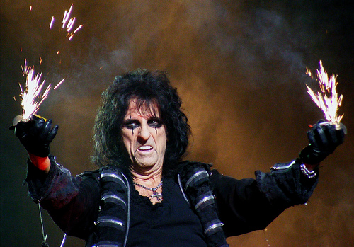 Picture of Alice Cooper with fire coming out of his hands