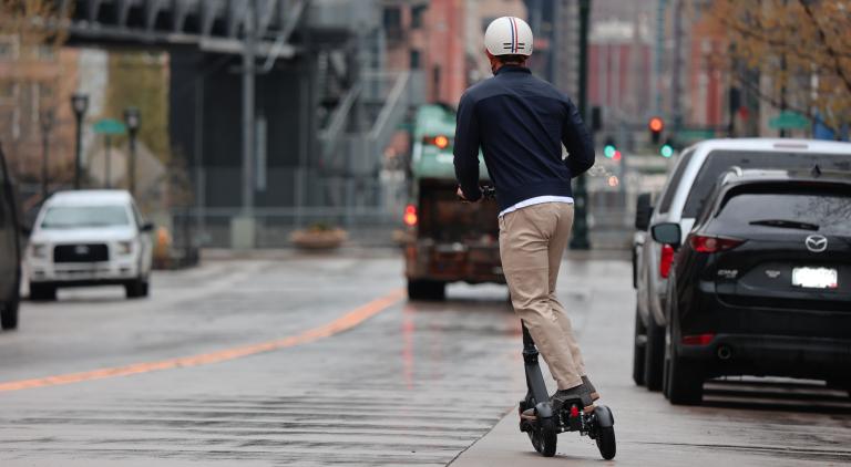 escooter rider on the road