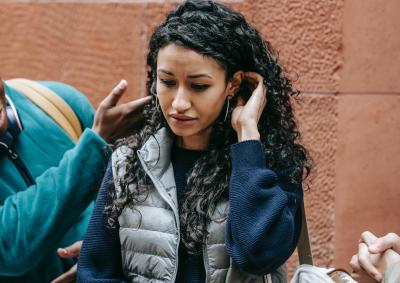 Woman being touched, uncomfortable