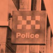 Police station sign red tinted image