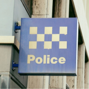 Blue and white police sign