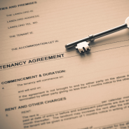 Tenancy agreement with old school key on top